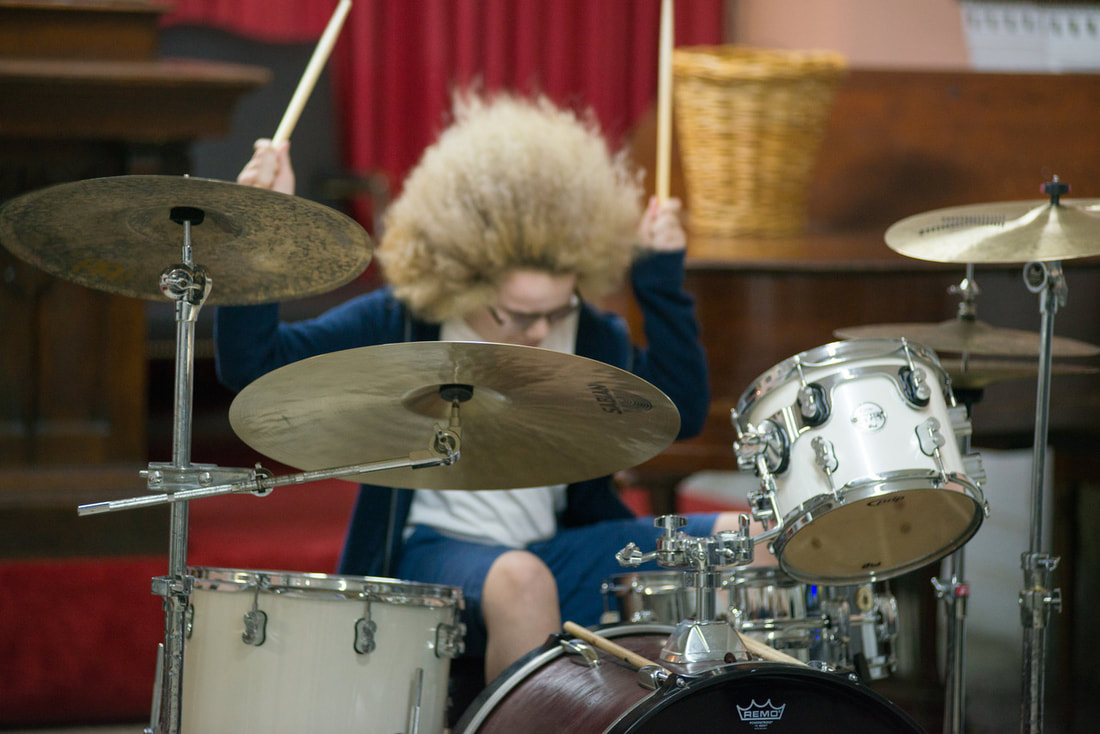 Pic of Drum Lesson Student Rocking Out